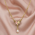Crystal Ivory And Pink Porcelain Rose Faux Pearl Drop Necklace by 1928 Jewelry