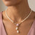 Porcelain Rose And 3mm Faux Pearl Strand Drop Pendant Necklace by 1928 Jewelry