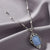 Jazzy Filigree Blue Octagon Moonstone And Crystal Pendant Necklace by 1928 Jewelry