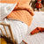 Smiles All Round SUGAR APRICOT Cot Coverlet (100 x 120cm)
